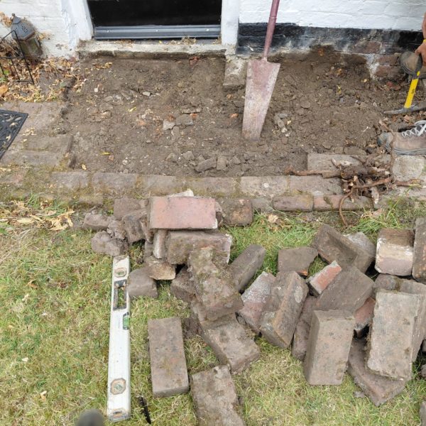 Uncovering original block paving on a Grade I listed building