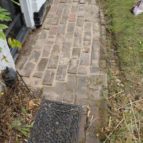 Repair and restoration work on the Grade I block paving